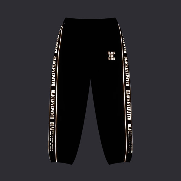 REFLECTIVE STENCIL LOGO TRACK PANTS BLACK